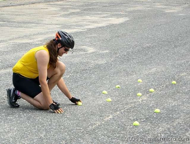 BikeSkillsB6_060715 Halves of tennis balls make a visible and safe obstacle course. Here, they create a narrow path, to practice zig-zagging around a pothole without changing course.