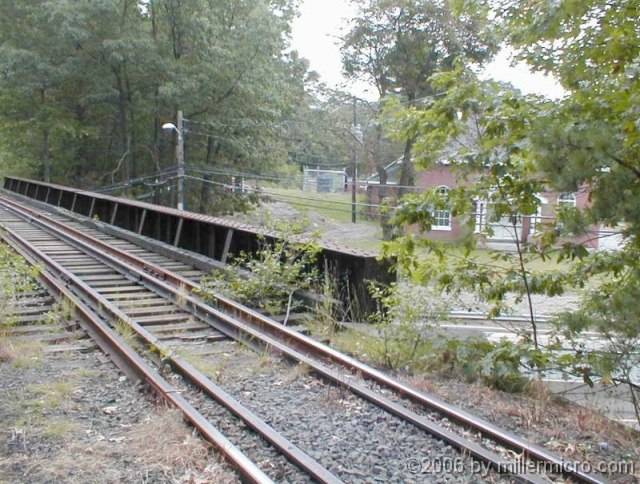 000924Rte9RRBridge You wouldn't want to bike over that! Walking over Route 9 traffic isn't much nicer, because of those open gaps between the railroad cross-ties.
