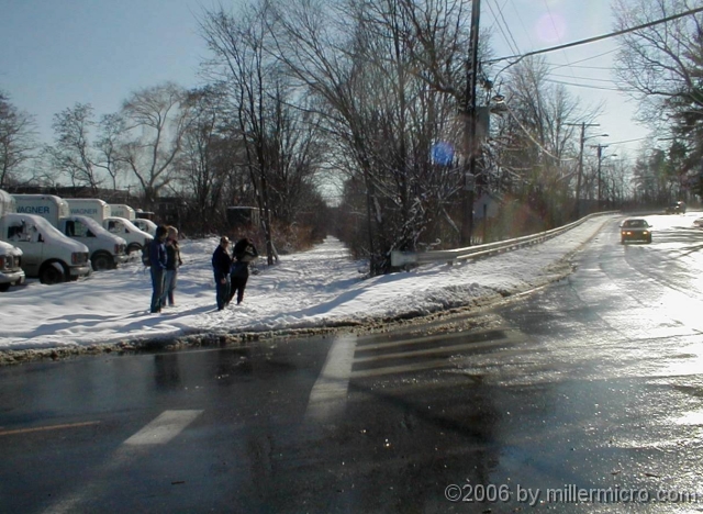 020120CRTSchoolSt In snow, that trail and the mis-aligned crosswalk are more obvious than in the prior photo.