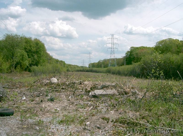050528NSTARPowerline1-81 PART 9 - NSTAR Power Line 1-81.
Southeast of the Circuit City store in Natick, a great swath of open space someday will provide Framingham and West Natick with an alternate transportation link to Natick Mall and the Cochituate Rail Trail.