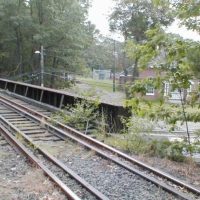 000924Rte9RRBridge You wouldn't want to bike over that! Walking over Route 9 traffic isn't much nicer, because of those open gaps between the railroad cross-ties.