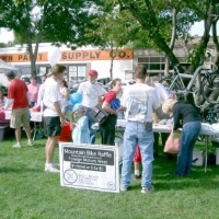 040911NatickDays PART 7 - Events.
Every September since 2001, the Natick Bicycle and Pedestrian Advisory Committee has partnered with other Town committees at Natick Days to publicize the Cochituate Rall Trail and gather new volunteers. Here, a folding mountain bike hoisted high and raffled off.
