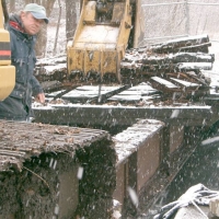 050105CRTBridgeDeck2 A bucket with extra teeth takes a big bite...