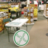 061019CRTTableAtEMS At a sale event, Eastern Mountain Sports hosts an exhibit and volunteer sign-up table for the Cochituate Rail Trail.