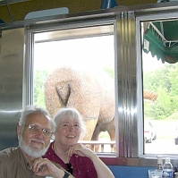 070601DickJillMooseButt On the drive up NH Route 16 to Cold River Camp, we stopped for lunch at  the Miss Wakefield Diner. That's your average carved wooden moose butt behind us, but there was nothing average about their eggs benedict over crabcake -- with home-fried potatoes on the side. Yum!
