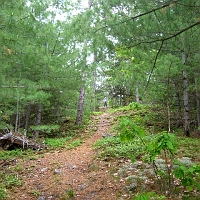 070602ColdRiverCamp_BobYellsDown Bob Goeke yells down from higher up on the Conant Trail loop.