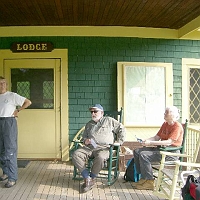 070602ColdRiverCamp_LodgePorch2 ..including Bernie Hickey (our friend and knowledgeable guide) and Jill.