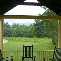 v070601ColdRiverCamp_Lodge2_1024 Our weekend was a fine one. Good campers, good place, good food. And we did some good, ourselves. The Lodge porch at Cold Spring Camp will call us back again!