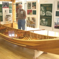 060622VTHighwayInfoCanoe Driving to Lake Morey from Massachusetts on I-91, we visited the first Vermont highway rest area. One of its exhibits featured this lovingly-crafted, square-ended canoe.