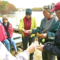 061026RockyNarrows10 At the beach on Farm Pond, Jill Miller of Natick (a botanist, and the owner of <a href=http://womanstouchgardening.com/> Woman's Touch Gardening</a>), identifies fallen leaves and shares information about the various trees from which they come.