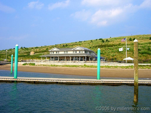 060727SpectacleIsland16 As we disembark, we can see the new headquarters building, just ashore.<br />That's not the main swimming beach; in fact, they had to remove a wharf finger when the main pier obstructed tidal currents and extended this beach out into previously deep water.