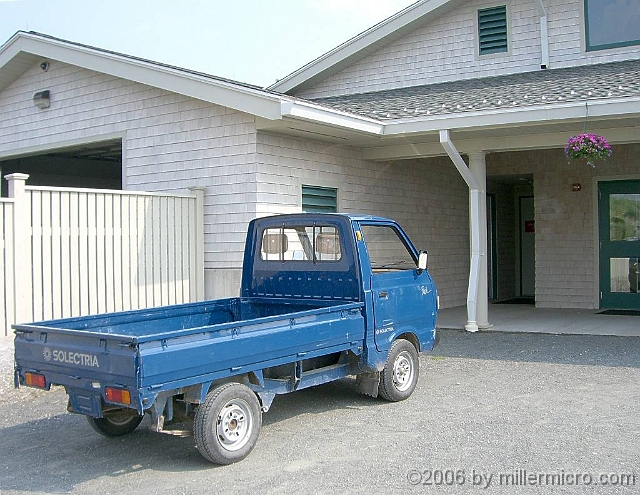060727SpectacleIslandSolectra2 The headquarters building and the rest of Spectacle Island are into alternative energy. Solar panels put energy back INTO the grid. A little fleet of small Solectria trucks recharge their batteries at night and run up to fifty miles per day.
