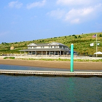 060727SpectacleIsland16 As we disembark, we can see the new headquarters building, just ashore.