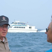 060727SpectacleIsland17 On the ride home, a ranger tells us about the other harbor traffic.