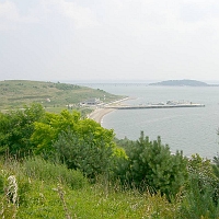 060727SpectacleIsland8 and a great view down to Spectacle Island's swimming beach, pier and headquarters building.