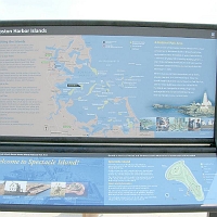 060727SpectacleIslandInfo1 On the pier, the first of many good informational signs tells us where we are and what it's all about.