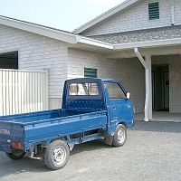 060727SpectacleIslandSolectra2 The headquarters building and the rest of Spectacle Island are into alternative energy. Solar panels put energy back INTO the grid. A little fleet of small Solectria trucks recharge their batteries at night and run up to fifty miles per day.